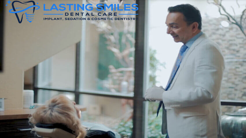 Dr Ghodsi, Las Vegas dental implant specialist, consulting with a patient